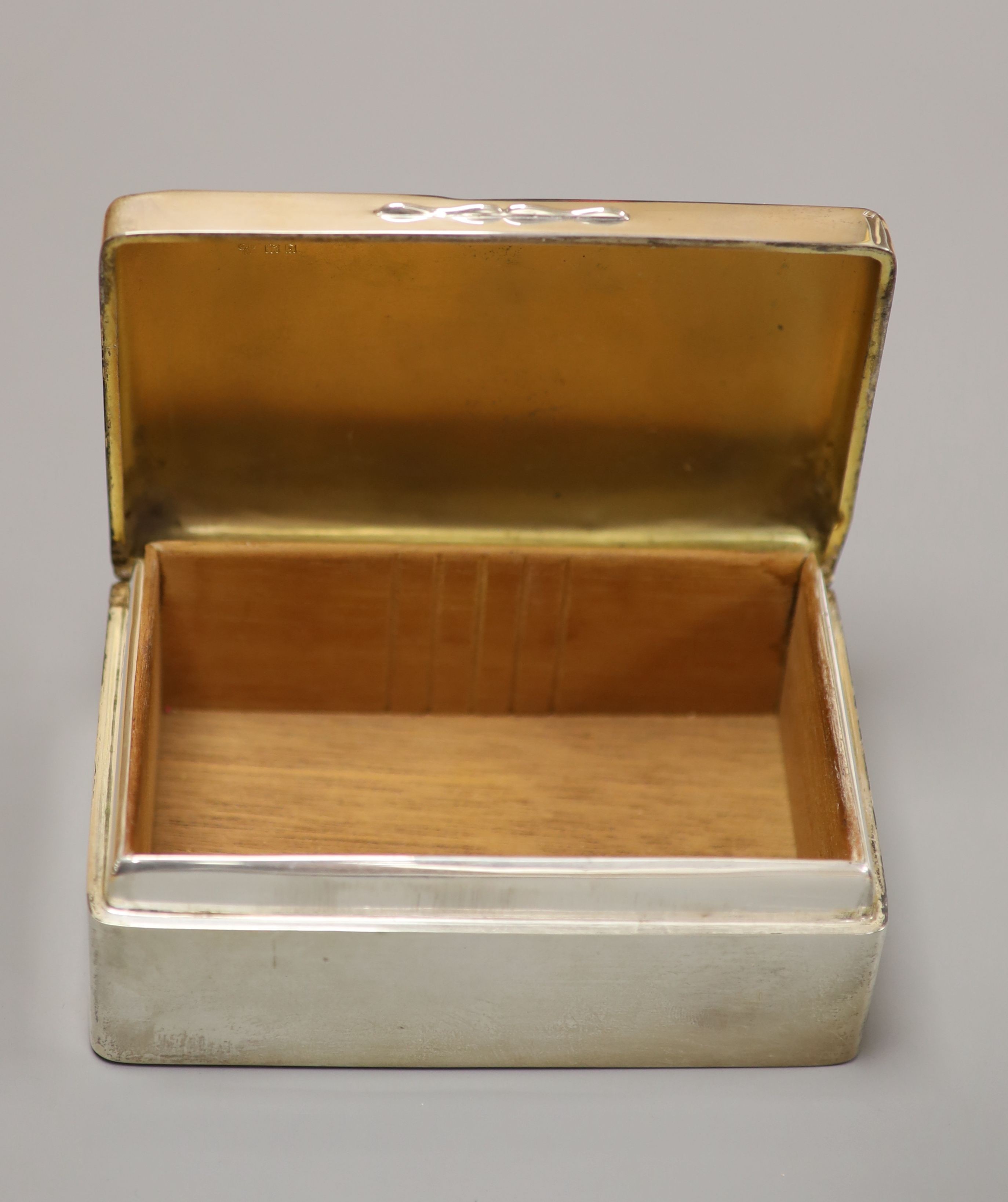 Three silver mounted cigarette cases, largest 17.9cm.